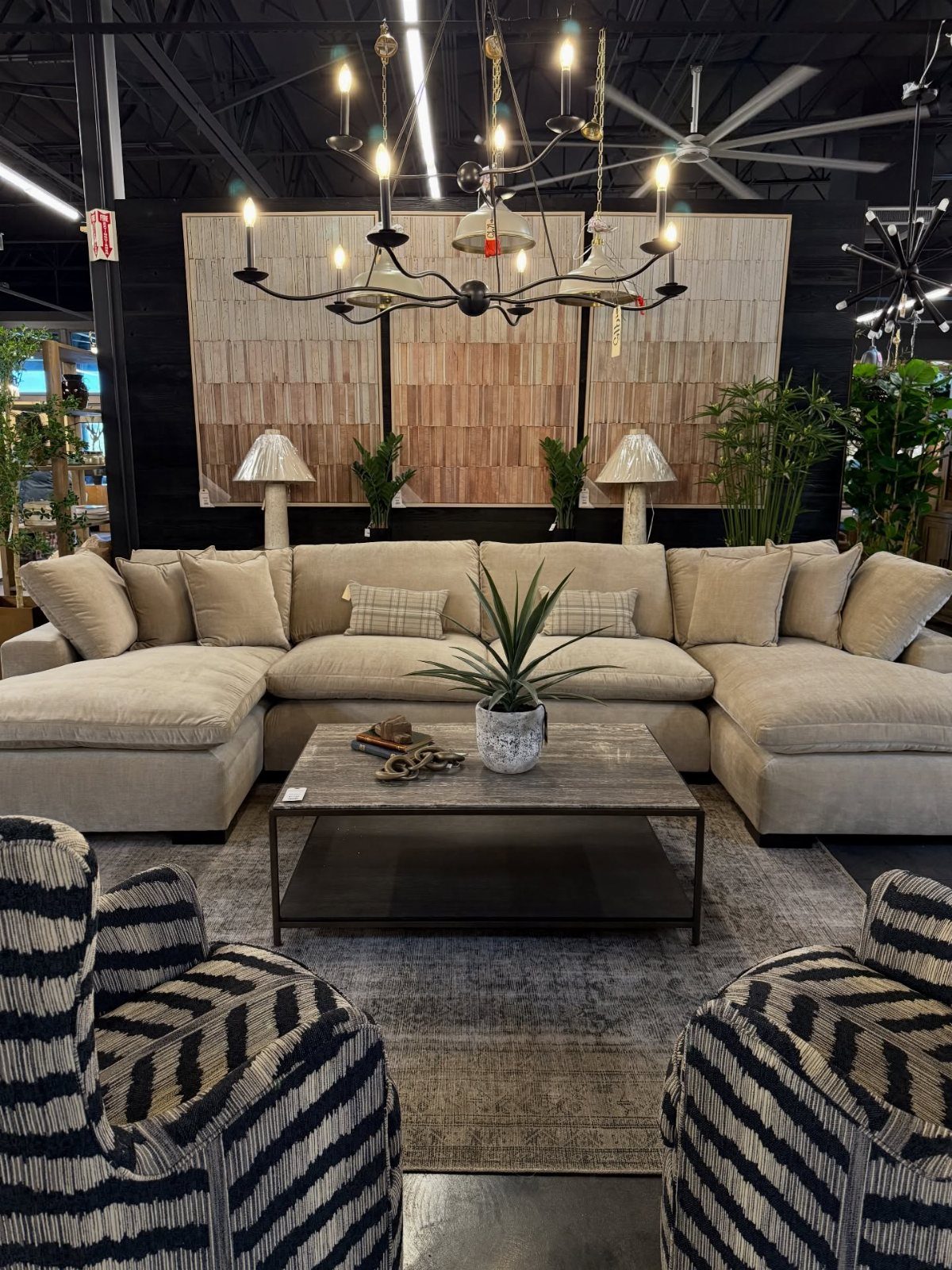 Beige sectional sofa and grey coffee table in a modern living room setting