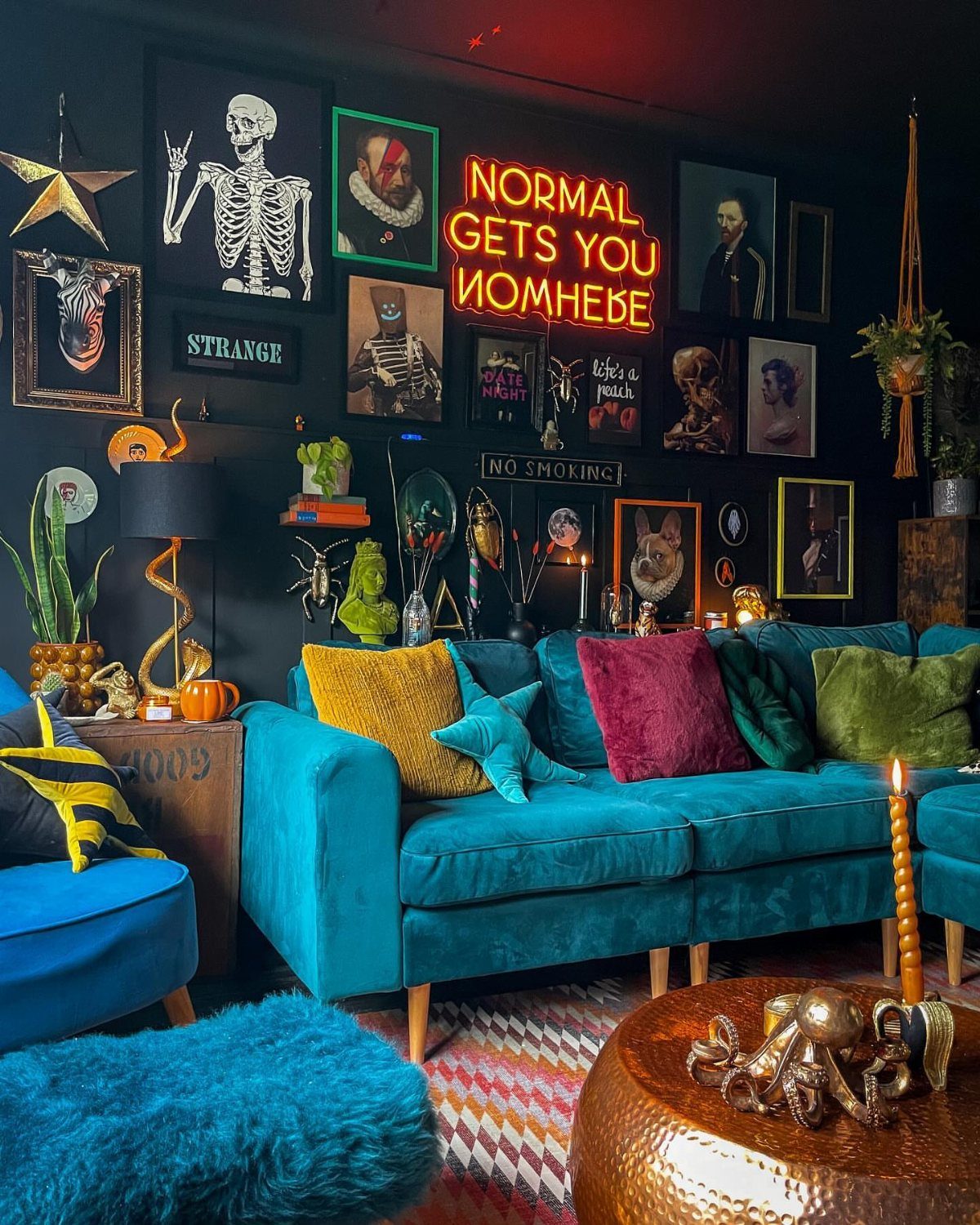 17 Black and Gold Living Room Ideas for Luxe Style 12 Eclectic living room with black walls, blue velvet sofa, and gold coffee table.