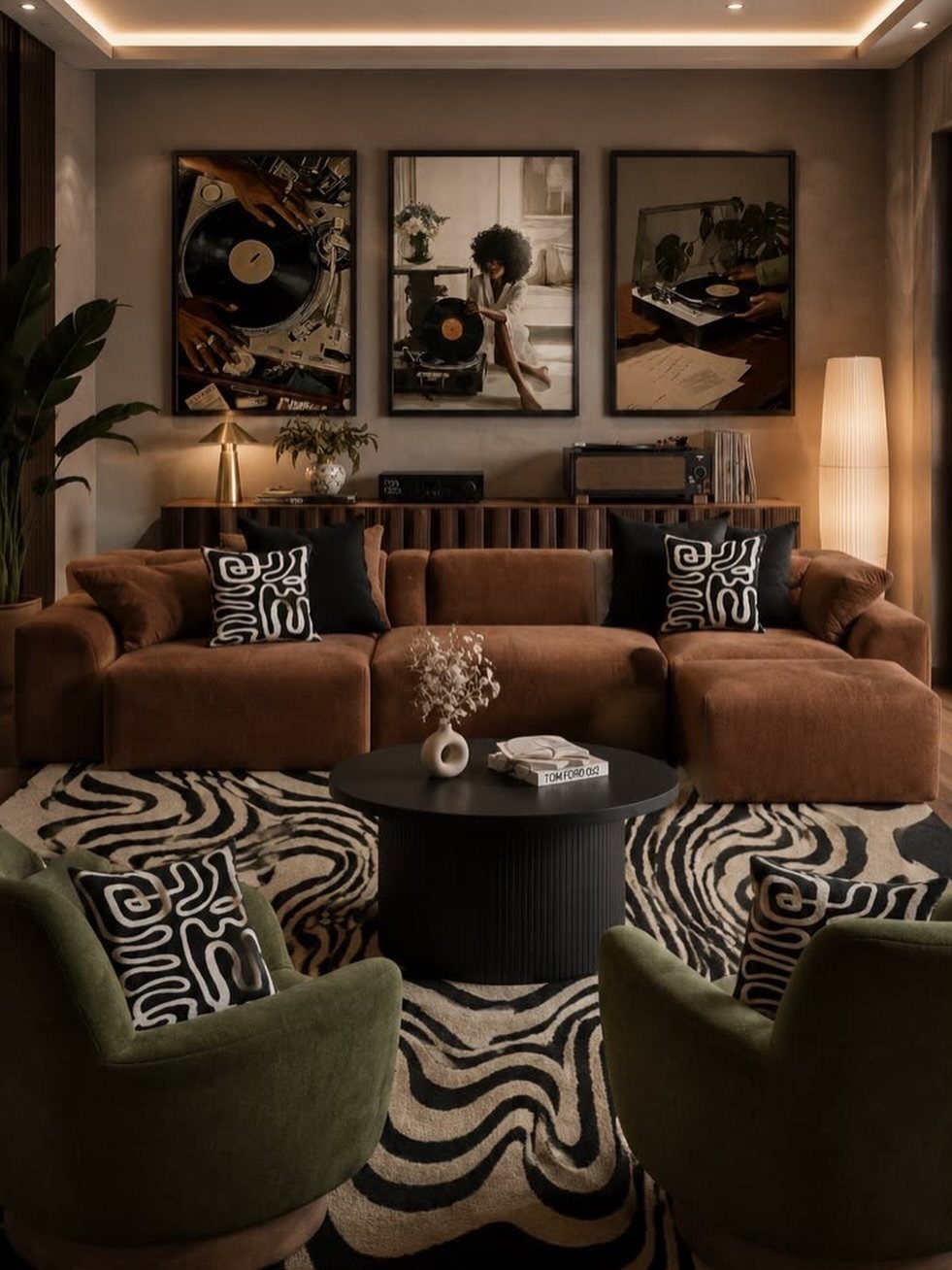 Dark boho living room with brown velvet sofa, green chairs, and wavy patterned rug.