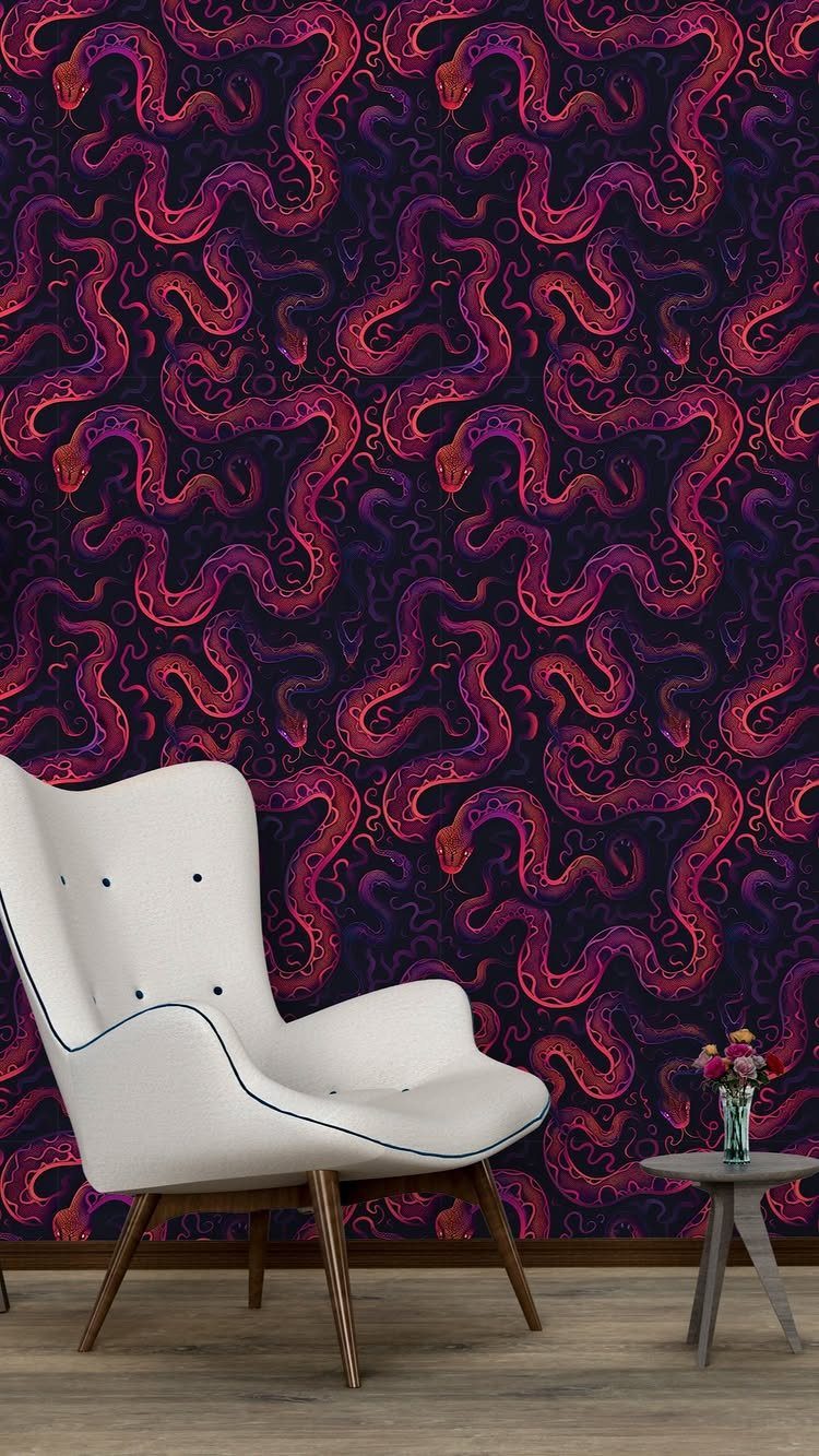 White modern armchair against dark purple wallpaper with large red snake patterns.