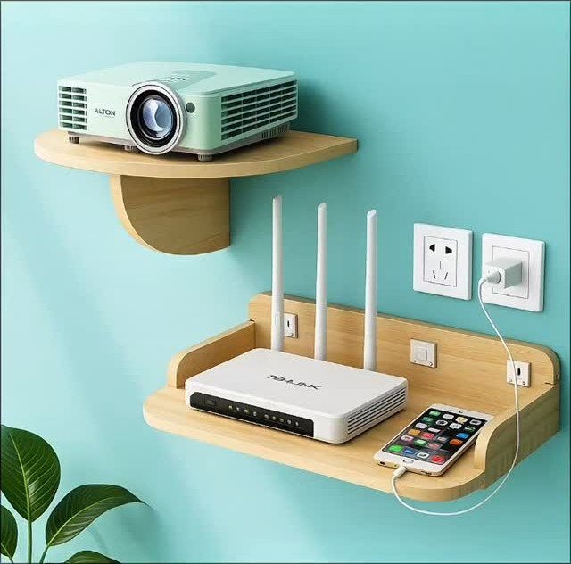 Wooden floating shelves holding a projector, Wi-Fi router, and smartphone on blue wall