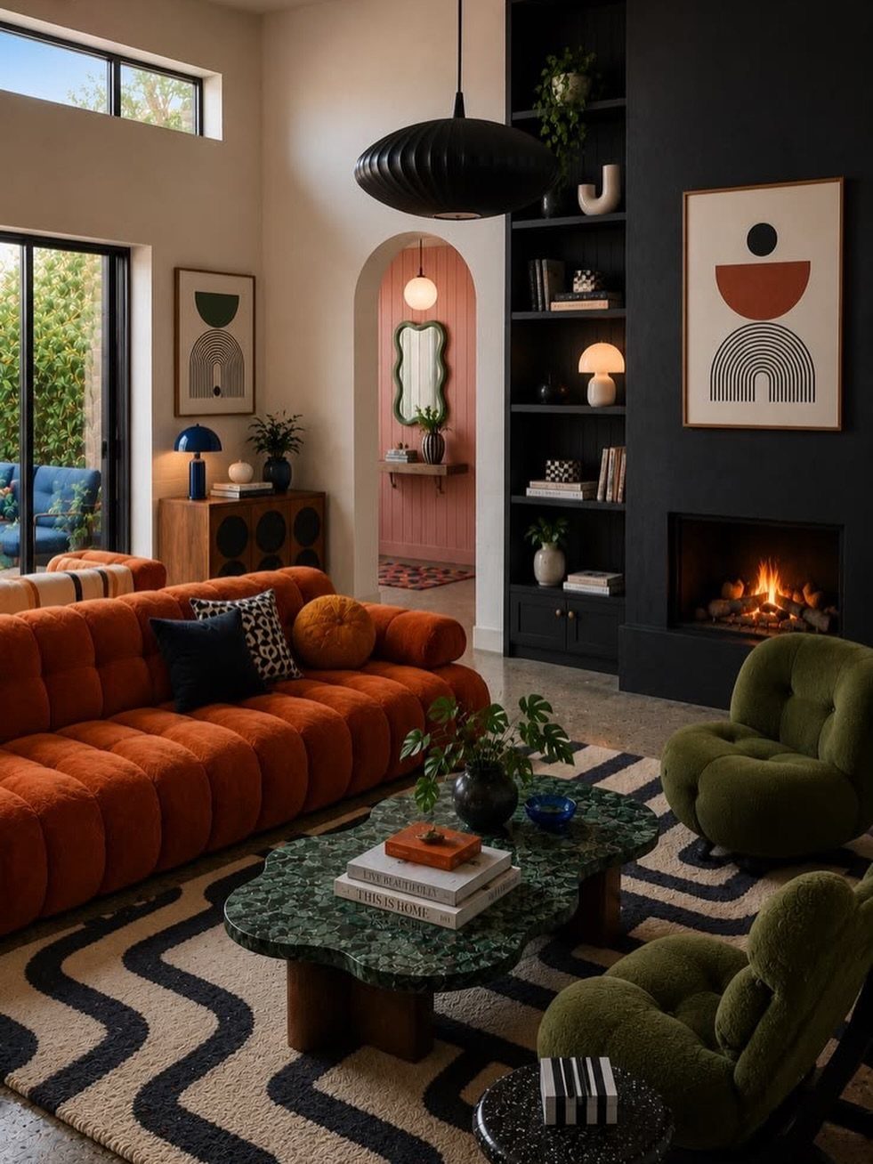 Burnt orange sofa and olive green armchairs in a modern living room with marble table.