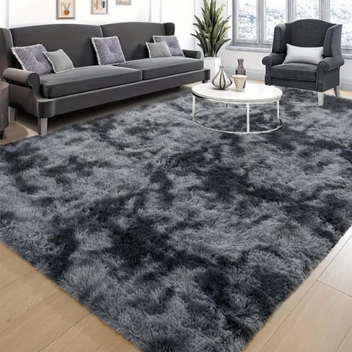 15 Grey Sofa Living Room Ideas with Real Style 10 Dark grey sofa and armchair on a large, plush dark grey shag rug.