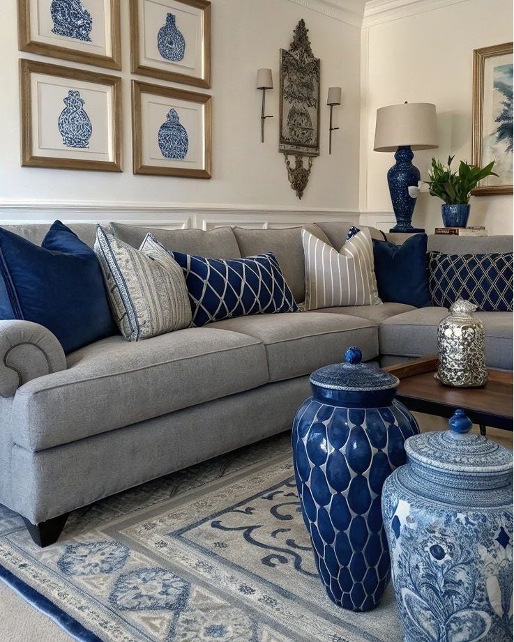 15 Grey Sofa Living Room Ideas with Real Style 5 Light grey sectional sofa with blue pillows and blue ceramic jars in living room.
