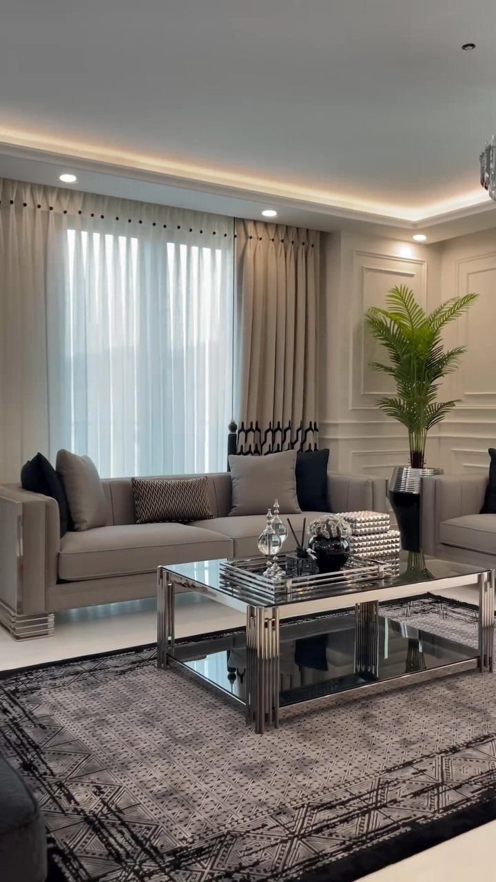 15 Grey Sofa Living Room Ideas with Real Style 11 Light grey sofa with mirrored coffee table and geometric rug in modern living room