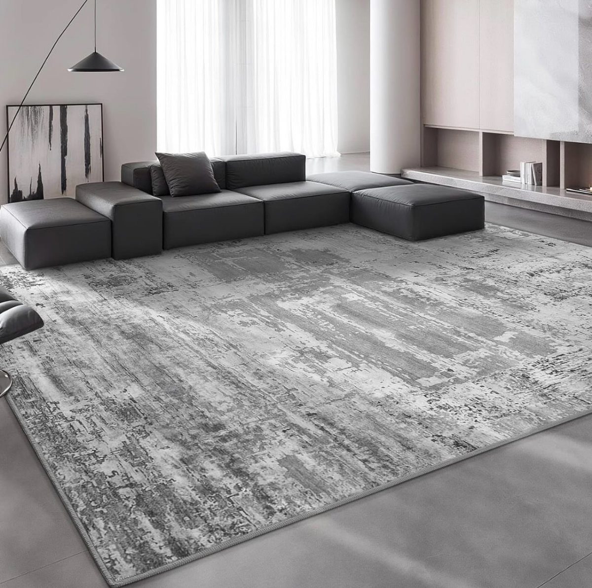 15 Grey Sofa Living Room Ideas with Real Style 15 Dark grey L-shaped modular sofa on a large distressed grey and white rug.