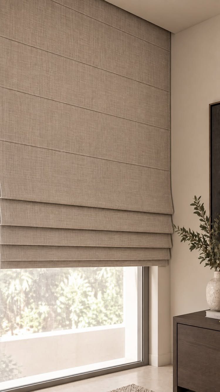 Beige Roman shade blind partially covering a window in a modern living room