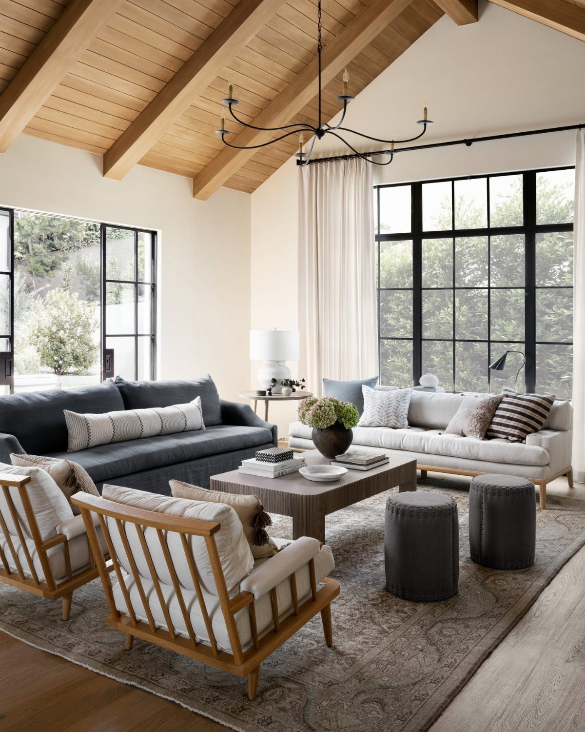 9 Living Room Couch Ideas for a Stylish Space 2 Two sofas in contrasting grey and cream tones facing each other in a living room.