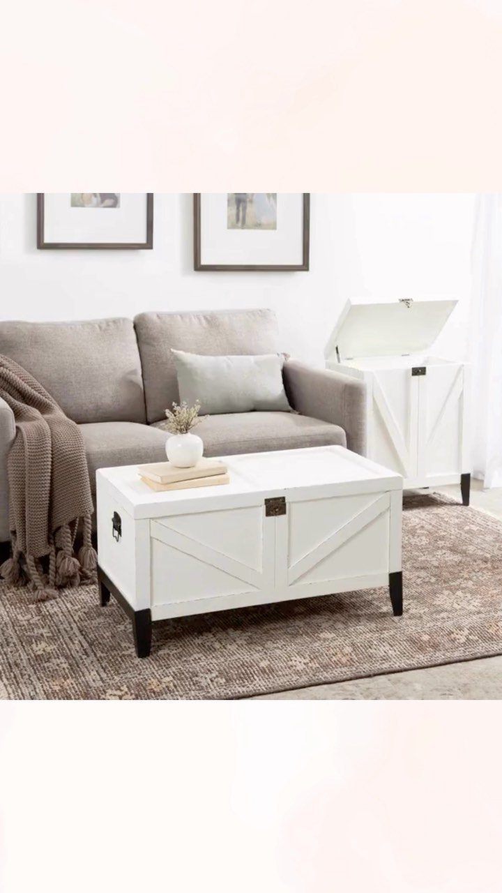 White wooden storage ottoman coffee table in a neutral toned living room setting