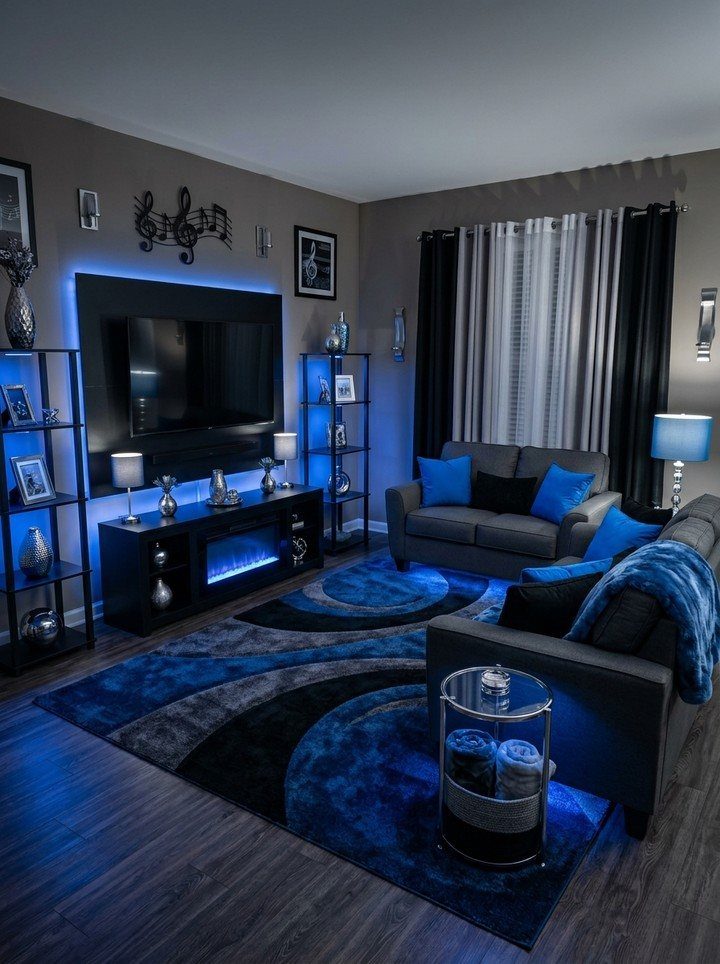 Living room with grey sofas and blue LED lighting on a patterned rug.